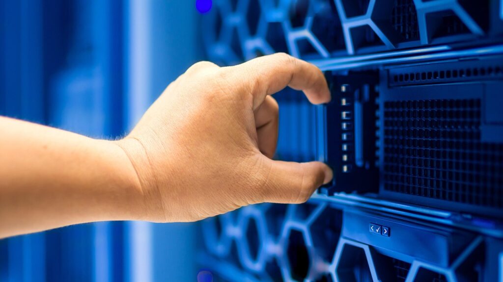 Engineer servicing a server in a data center rack