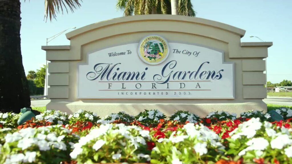 Welcome to the City of Miami Gardens, Florida sign surrounded by flowers